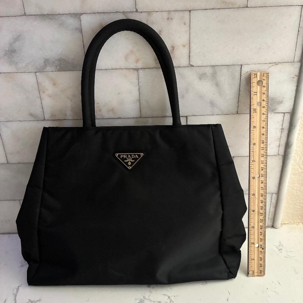 PradaNylon Tote Triangle Logo Used condition 
Wear to bottom of bag and handles